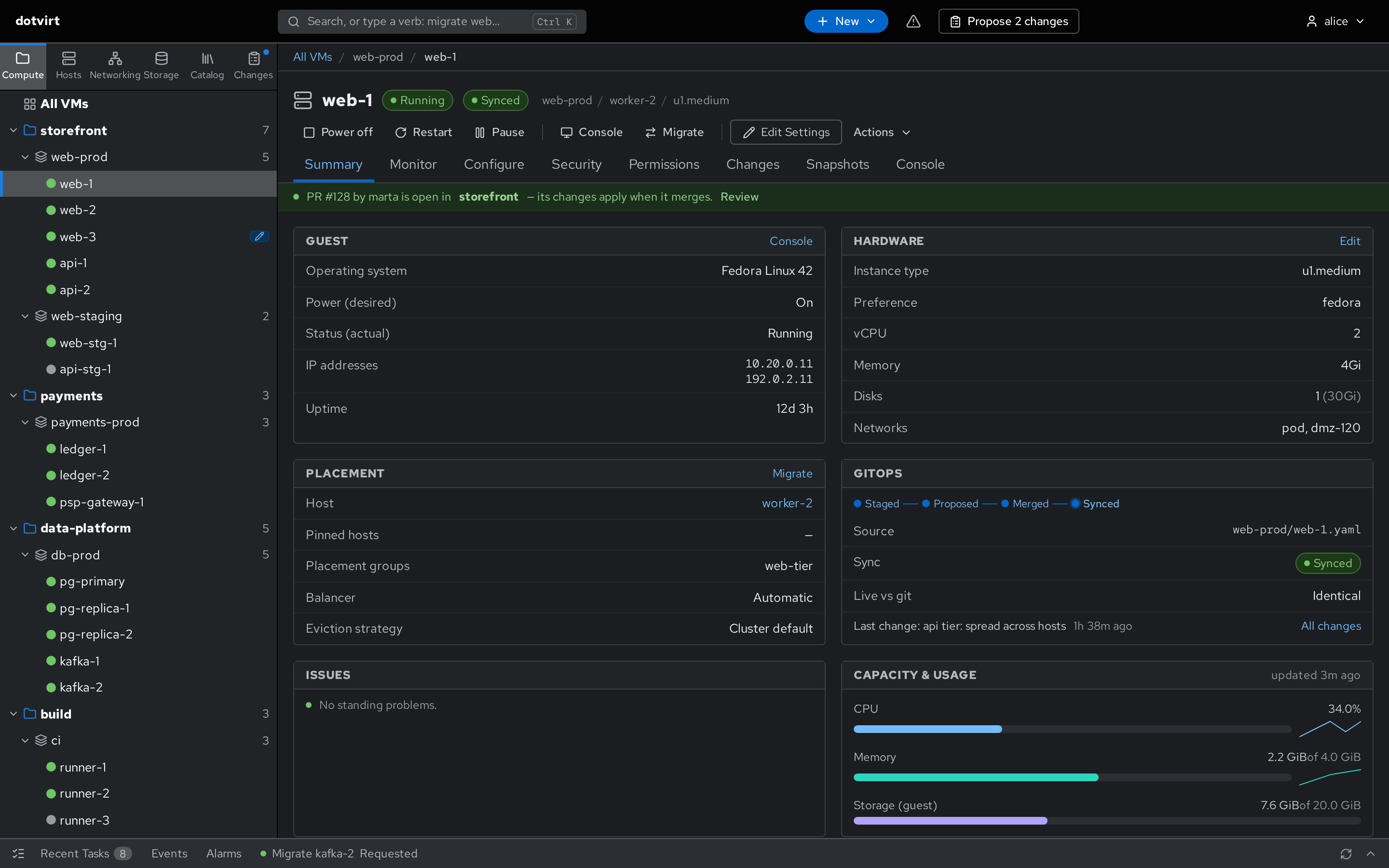 VM page: guest, hardware and placement cards, and a GitOps card showing staged, proposed, merged, synced